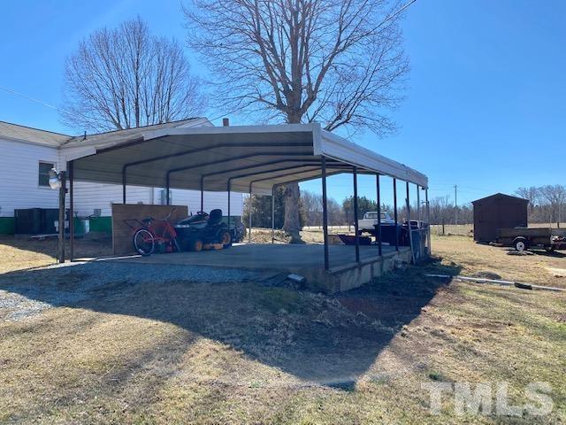 871 Halifax Road Roxboro, NC 27573 - Photo 37 of 45 a view of a patio with furniture and wooden floor