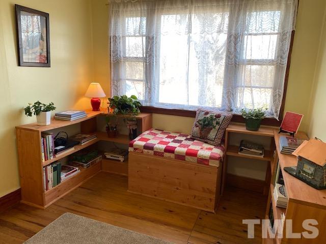 871 Halifax Road Roxboro, NC 27573 - Photo 6 of 45 a bedroom with a bed and wooden floor