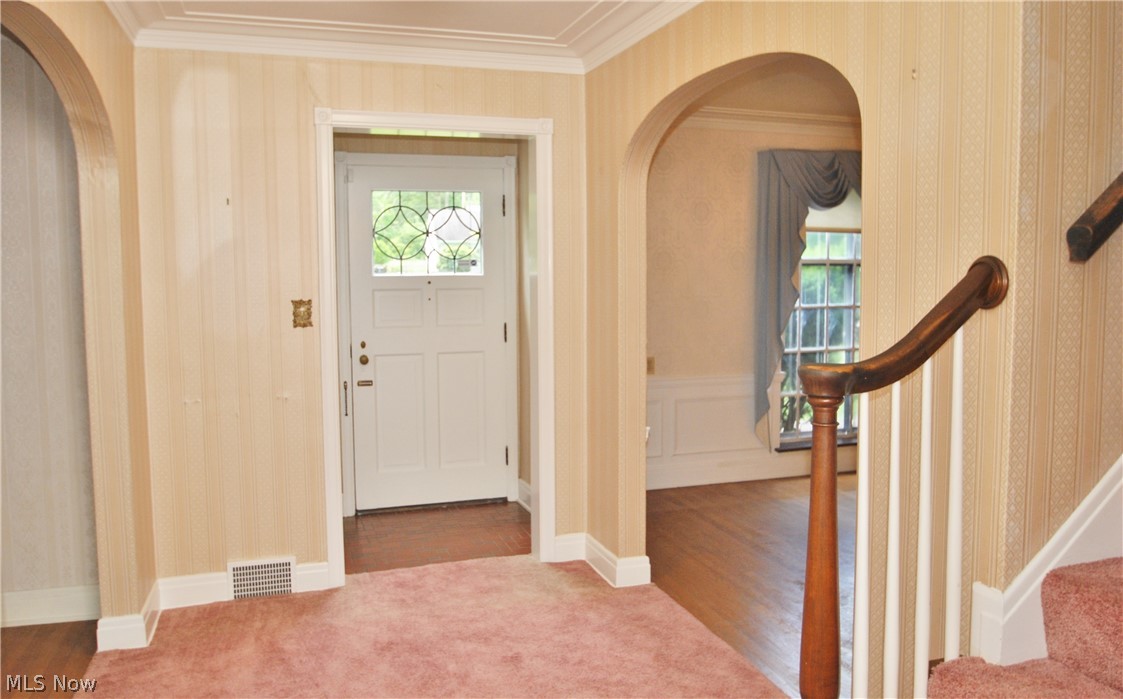 187 Durward Road Akron, OH 44313 - Photo 2 of 21 The original vestibule has a leaded glass front door, ceramic floor and guest closet. 3 arched doorways enhance the foyer.