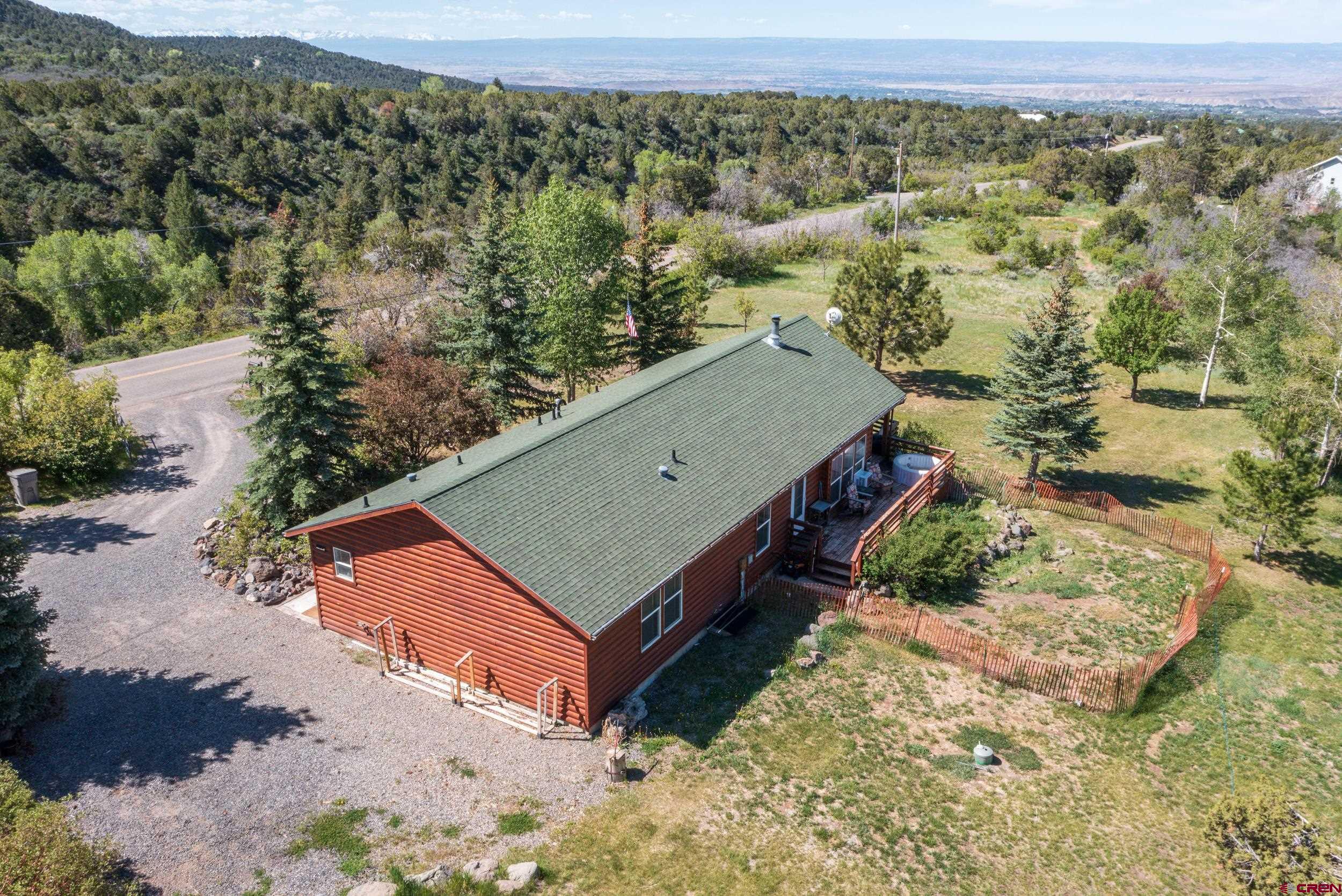 20751 Surface Creek Road Cedaredge, CO 81413 - Photo 4 of 35 an aerial view of a house with a yard