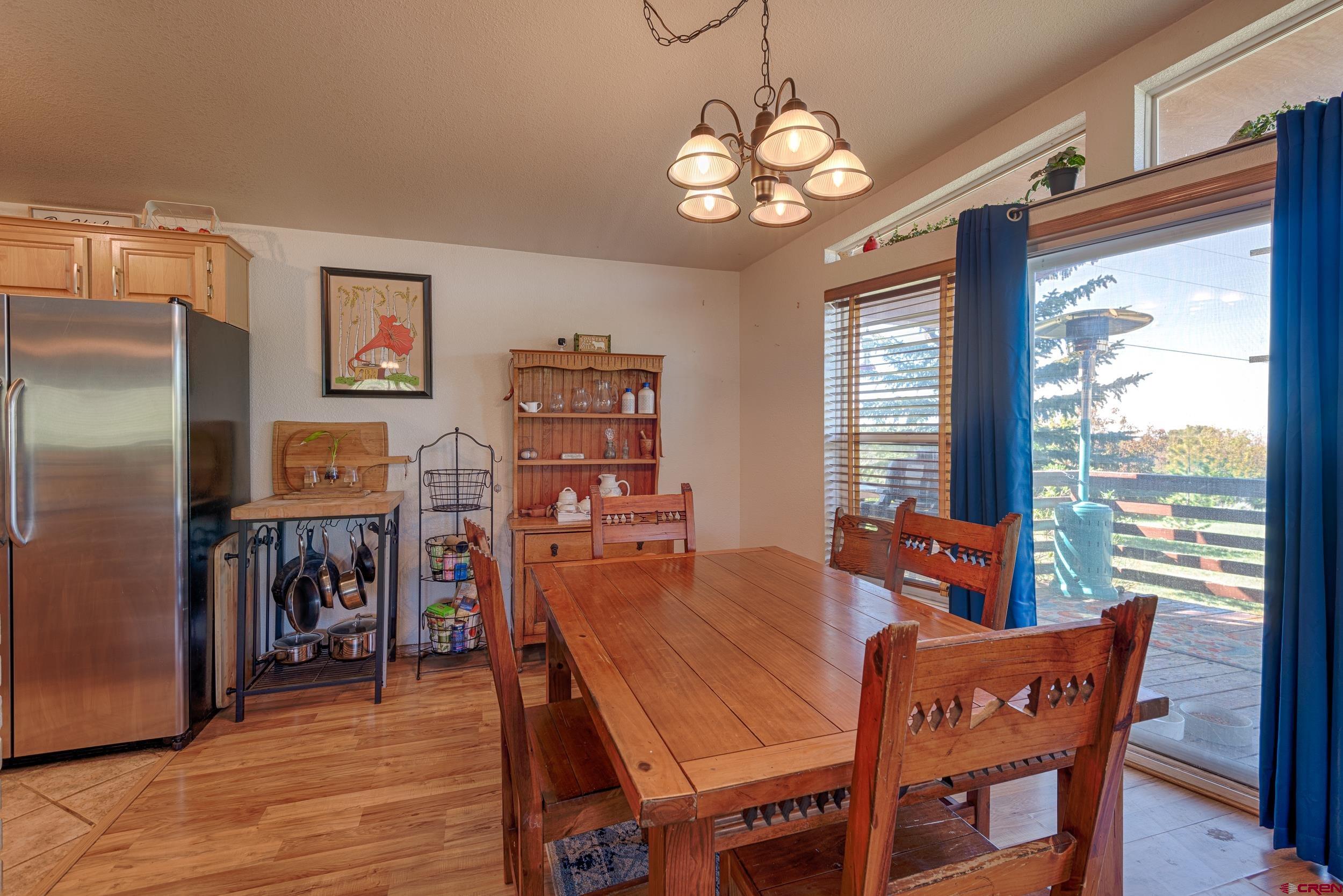 20751 Surface Creek Road Cedaredge, CO 81413 - Photo 8 of 35 a view of a dining room with furniture window and outside view