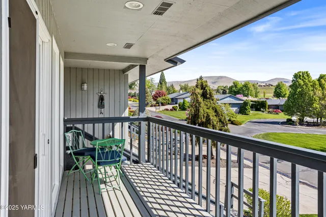 a view of a balcony with wooden floor