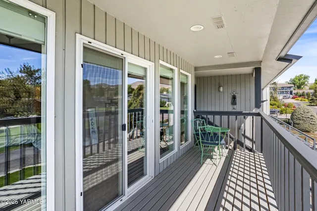 a view of balcony with wooden floor