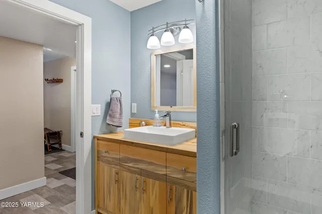 a bathroom with a sink and a mirror