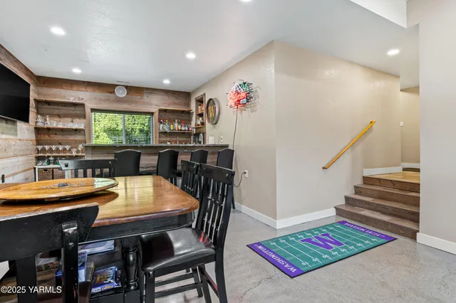 a dining room with furniture and window
