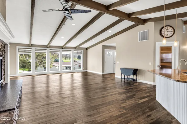 a view of balcony with wooden floor