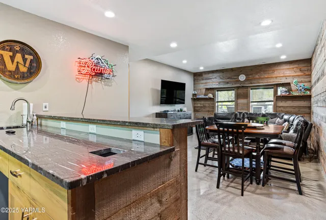 a kitchen with a sink cabinets and window