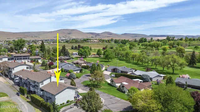 a view of a city with green space