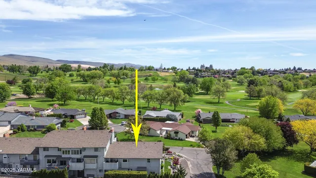 an aerial view of house with yard swimming pool and outdoor seating
