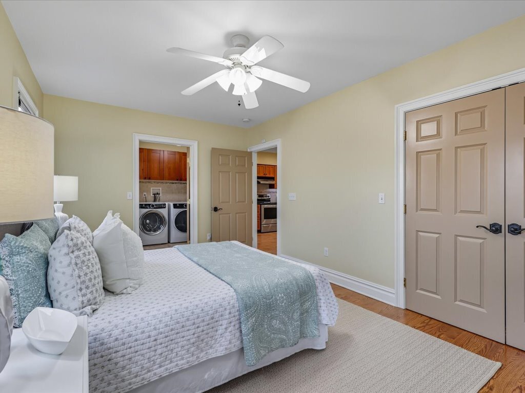 217 Huntington Road Stratford, CT 06614 - Photo 12 of 39 a bedroom with a large bed and a chandelier