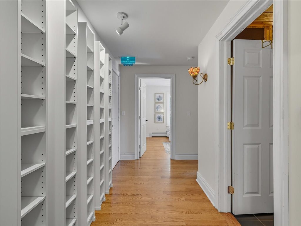 217 Huntington Road Stratford, CT 06614 - Photo 20 of 39 a view of a hallway with wooden shelves