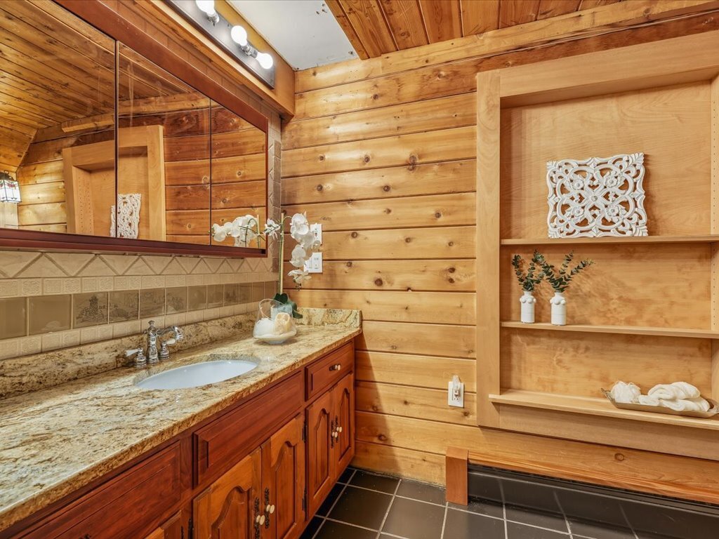 217 Huntington Road Stratford, CT 06614 - Photo 21 of 39 a bathroom with a granite countertop sink and a mirror