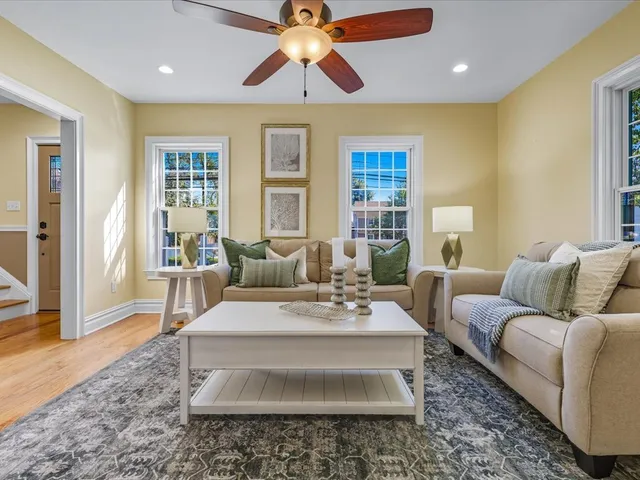 a living room with furniture and a rug