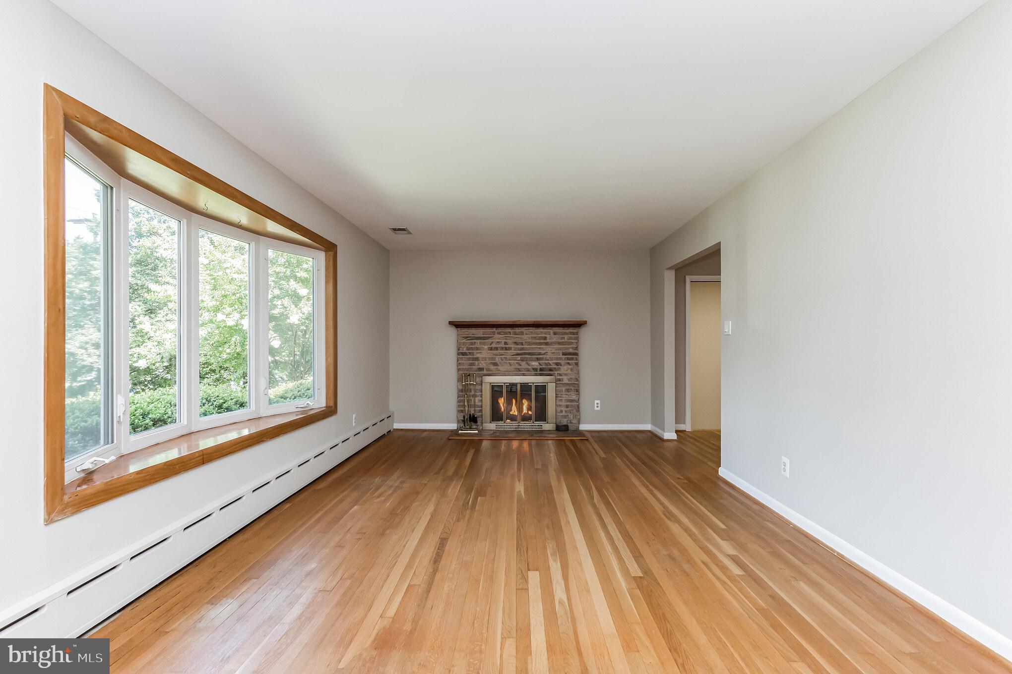 11407 Norris Drive Silver Spring, MD 20902 - Photo 3 of 37 Inviting living room features a gas fireplace