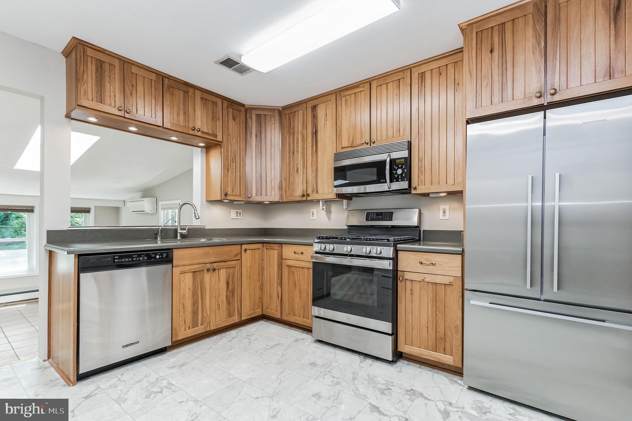 11407 Norris Drive Silver Spring, MD 20902 - Photo 8 of 37 Updated kitchen with stainless steel appliances
