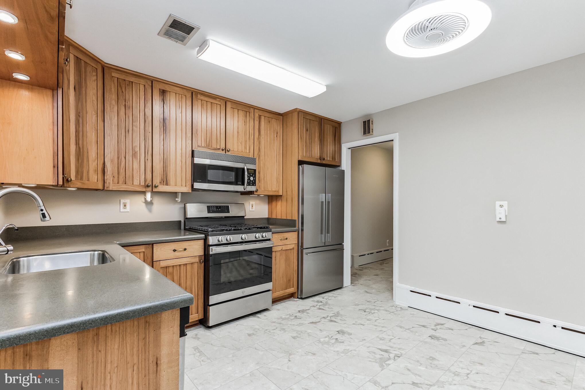 11407 Norris Drive Silver Spring, MD 20902 - Photo 10 of 37 Kitchen opens to the foyer and bedrooms