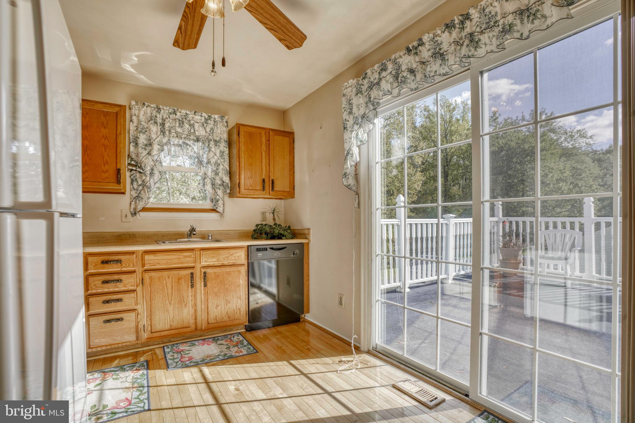 7203 Oliver Beach Road Baltimore, MD 21220 - Photo 23 of 50 Kitchen with sliding glass door to deck.