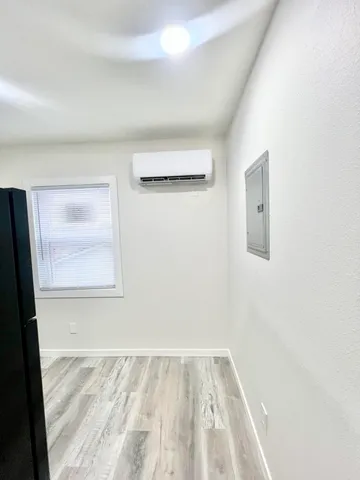 a kitchen with stainless steel appliances granite countertop a refrigerator and a stove