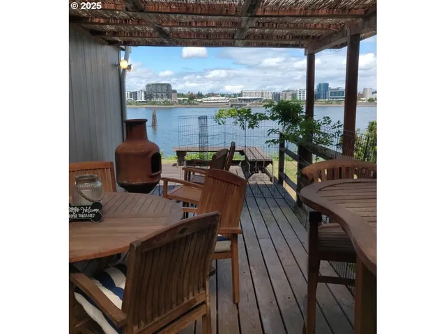 a view of a balcony dining table and chairs