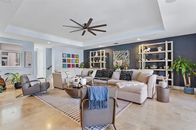 a living room with furniture and a potted plant