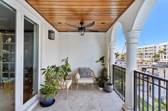 a balcony with potted plants