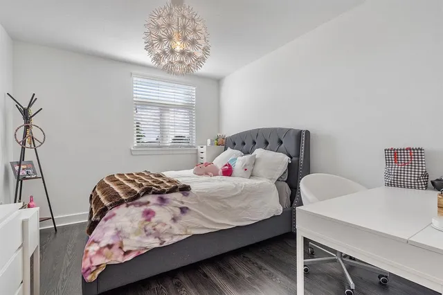 a bedroom with a bed and a table