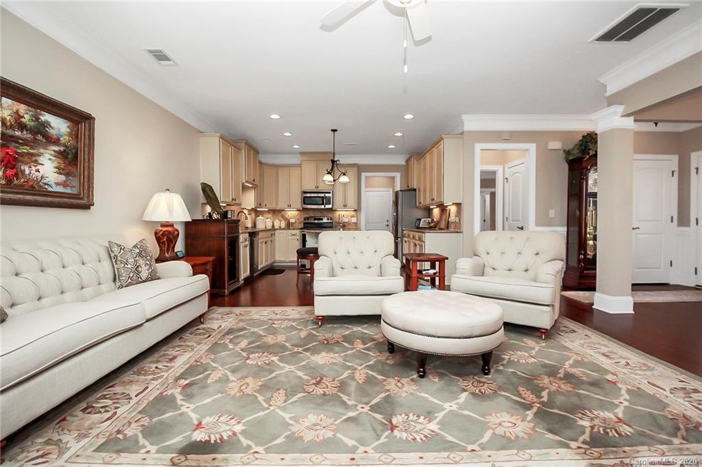 911 Ospre Lane Fort Mill, SC 29708 - Photo 11 of 45 a living room with a couch and a view of kitchen appliances