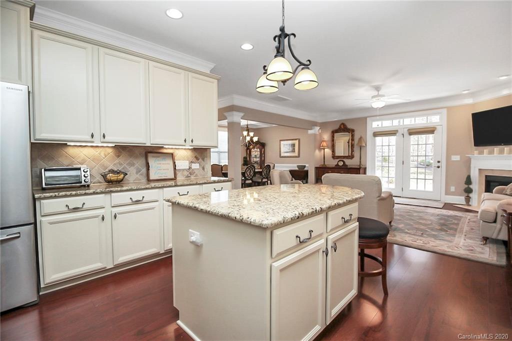 911 Ospre Lane Fort Mill, SC 29708 - Photo 16 of 45 a kitchen with stainless steel appliances granite countertop a stove and cabinets