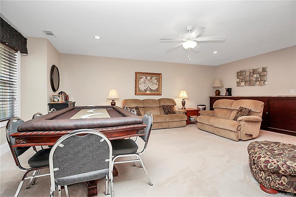 911 Ospre Lane Fort Mill, SC 29708 - Photo 27 of 45 a living room with furniture a couch and a flat screen tv