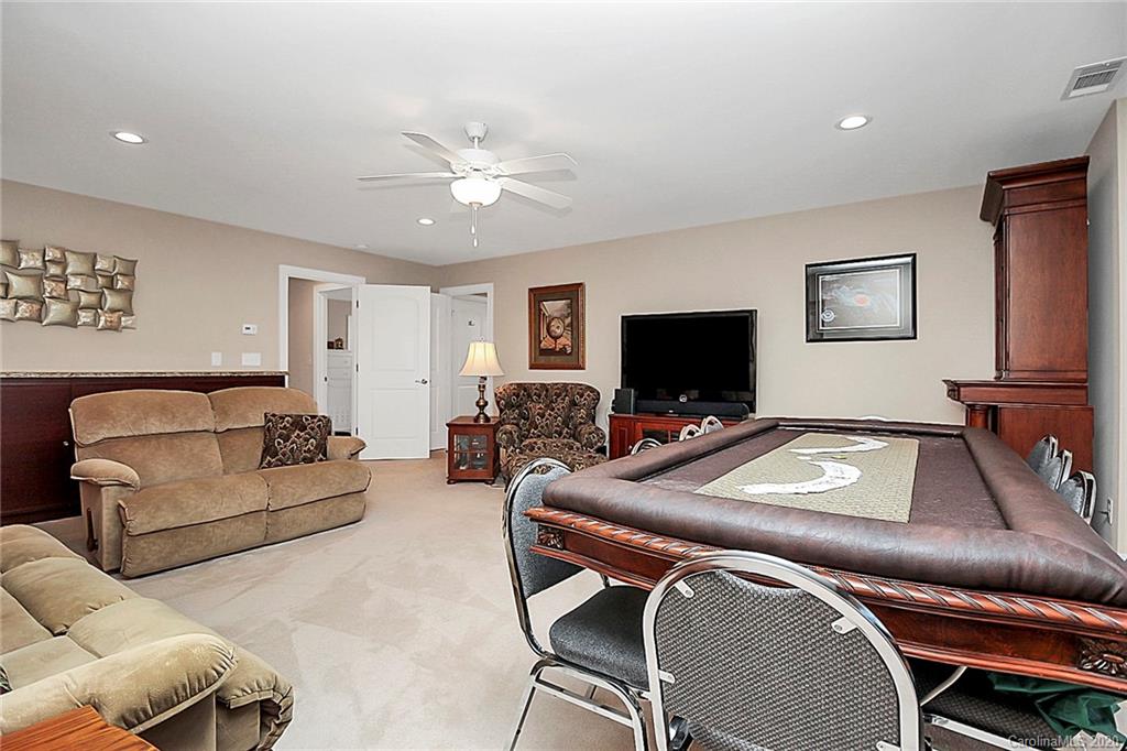 911 Ospre Lane Fort Mill, SC 29708 - Photo 28 of 45 a living room with furniture and a flat screen tv