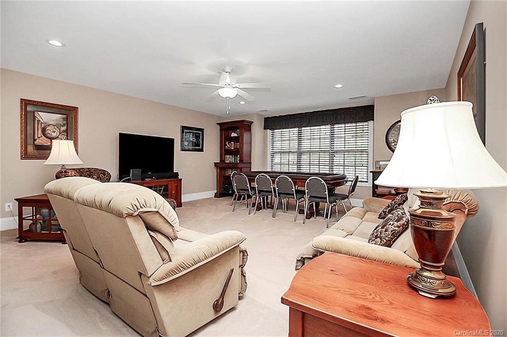 911 Ospre Lane Fort Mill, SC 29708 - Photo 29 of 45 a living room with furniture and a flat screen tv