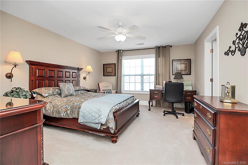 911 Ospre Lane Fort Mill, SC 29708 - Photo 35 of 45 a bedroom with a bed work place and a desk