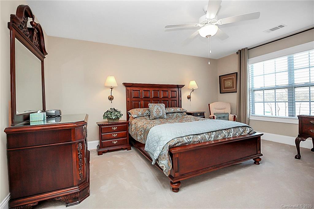 911 Ospre Lane Fort Mill, SC 29708 - Photo 36 of 45 a bedroom with a bed dresser and a window