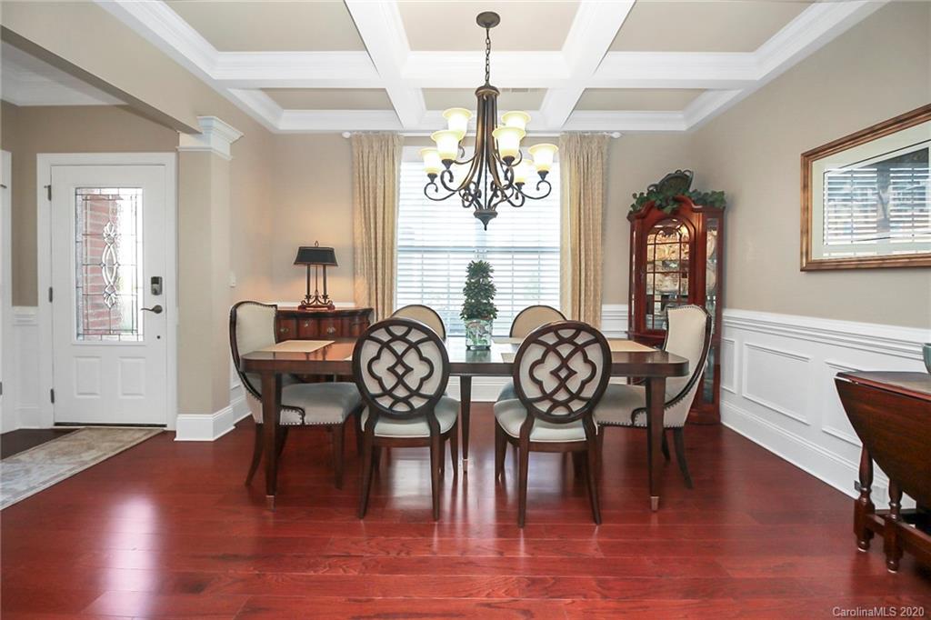 911 Ospre Lane Fort Mill, SC 29708 - Photo 5 of 45 a view of a a dining room with furniture window and wooden floor