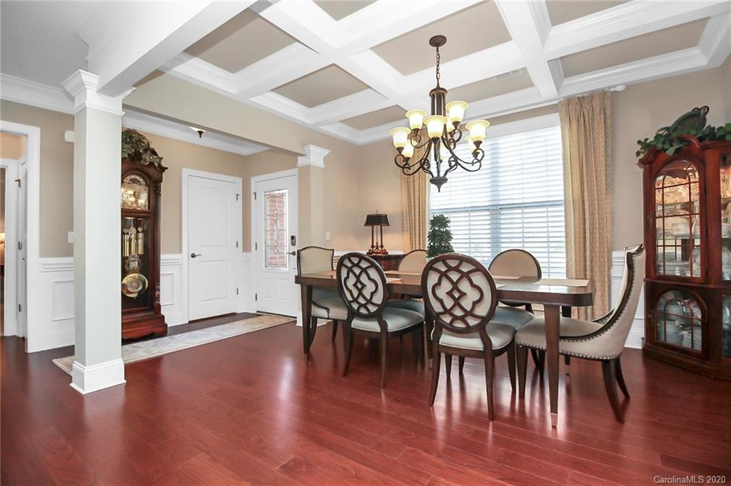 911 Ospre Lane Fort Mill, SC 29708 - Photo 6 of 45 a view of a a dining room with furniture window and wooden floor