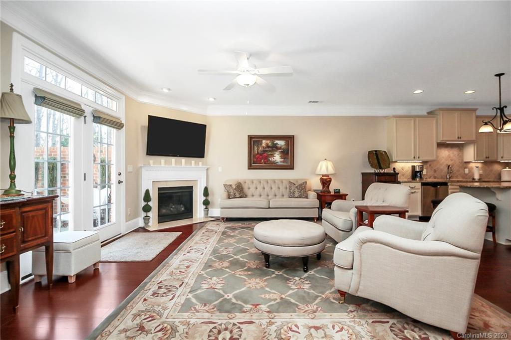 911 Ospre Lane Fort Mill, SC 29708 - Photo 8 of 45 a living room with furniture a fireplace and a flat screen tv