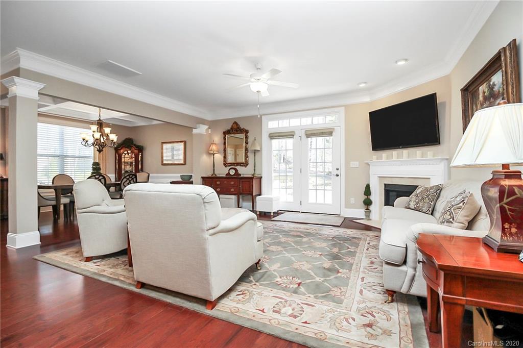911 Ospre Lane Fort Mill, SC 29708 - Photo 9 of 45 a living room with fireplace furniture and a flat screen tv