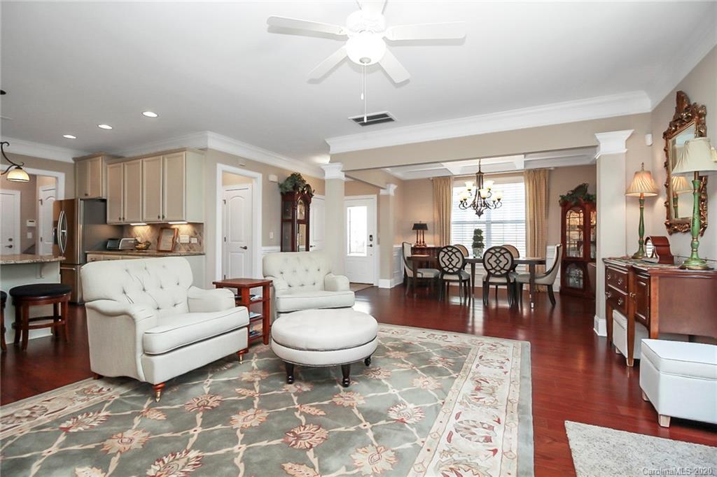 911 Ospre Lane Fort Mill, SC 29708 - Photo 10 of 45 a living room with lots of white furniture and view of kitchen