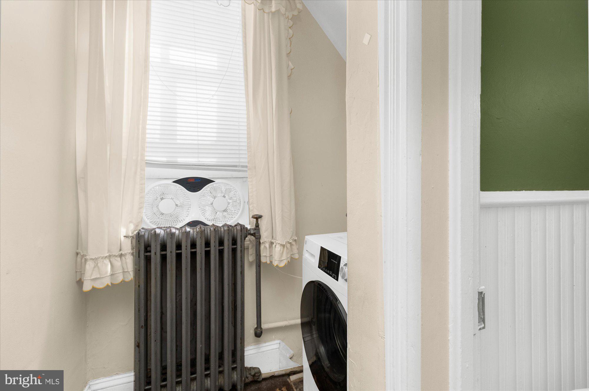 40 Union Street Mount Holly, NJ 08060 - Photo 28 of 41 a close view of utility room with dryer and washer