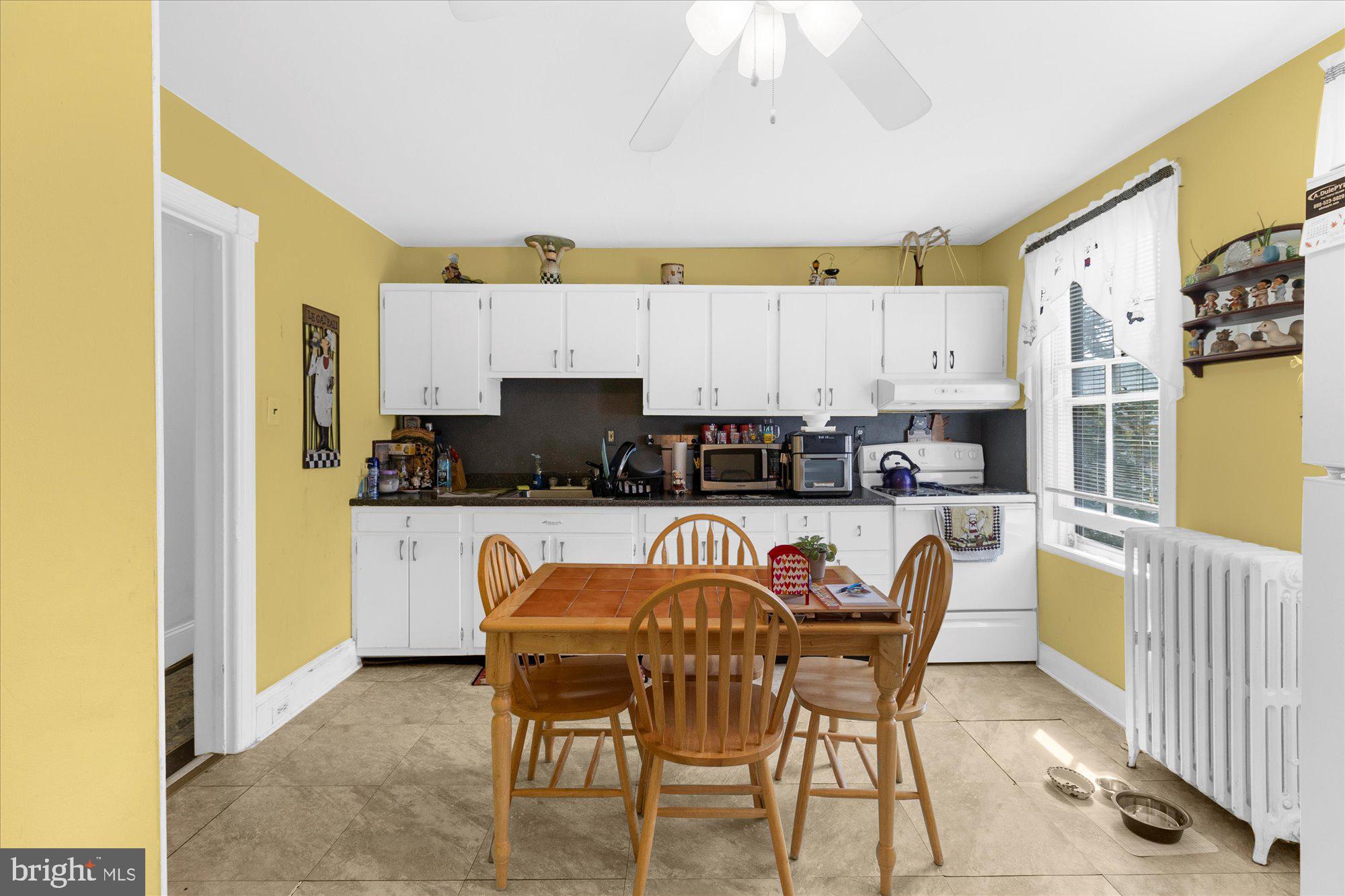 40 Union Street Mount Holly, NJ 08060 - Photo 37 of 41 a view of kitchen with stainless steel appliances granite countertop dining table chairs sink and cabinets