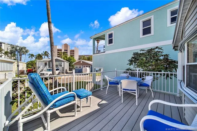 a view of a balcony with chairs