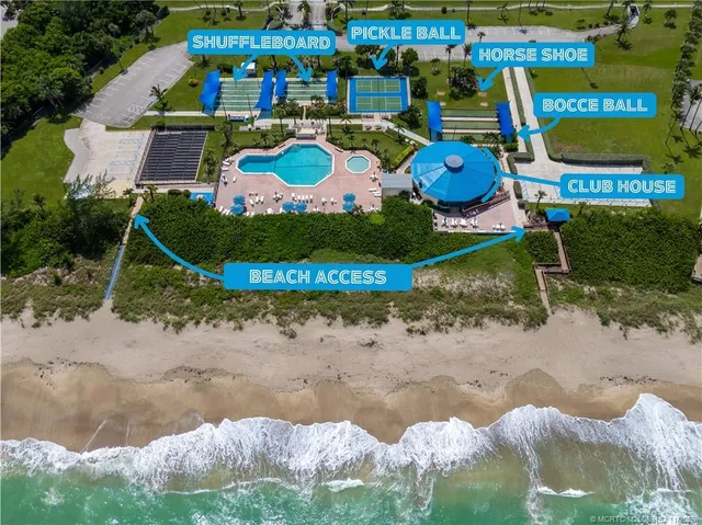 a view of swimming pool with outdoor seating and yard