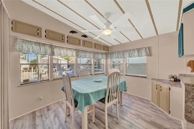 a dining room with furniture and window