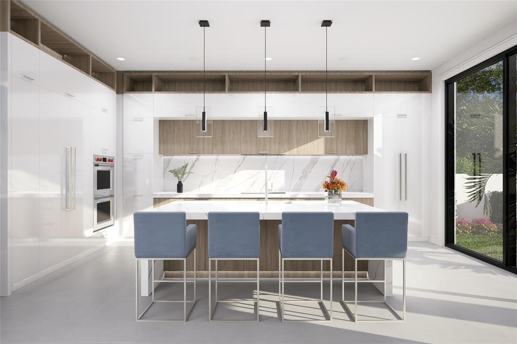 1625 Southeast 1st Street Fort Lauderdale, FL 33301 - Photo 9 of 14 a kitchen with stainless steel appliances kitchen island granite countertop a dining table chairs and white cabinets