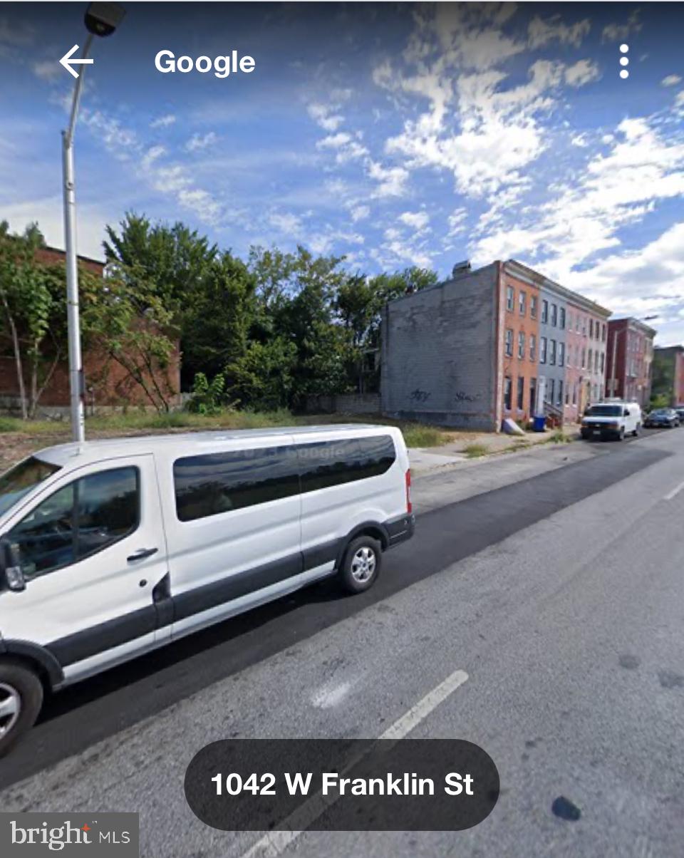 1040 West Franklin Street Baltimore, MD 21223 - Photo 2 of 3 a view of a street with a building in the background