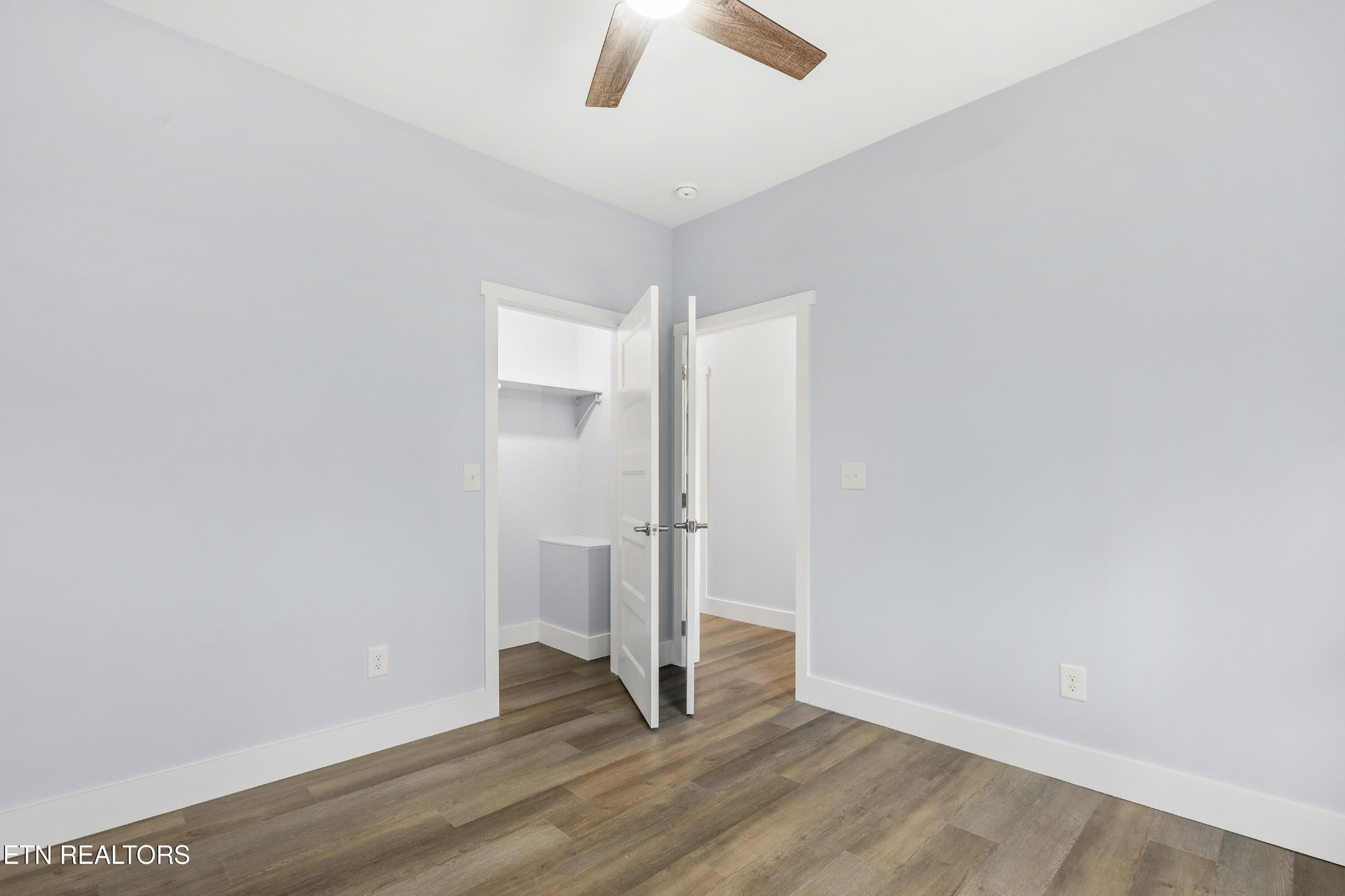 3436 Gap Road Knoxville, TN 37921 - Photo 21 of 25 an empty room with wooden floor and ceiling fan