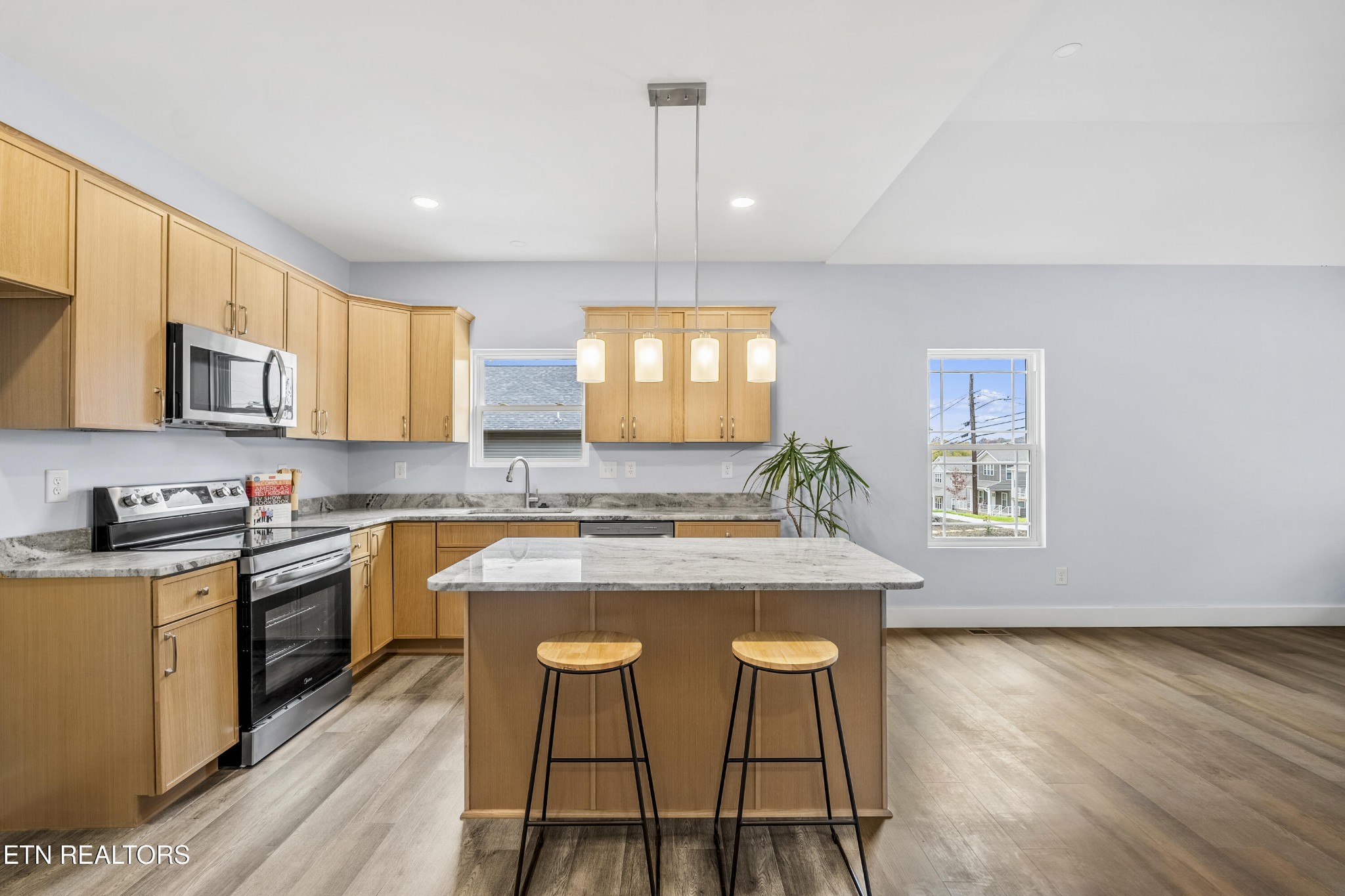 3436 Gap Road Knoxville, TN 37921 - Photo 10 of 25 a kitchen with kitchen island granite countertop a stove a sink a refrigerator dining table and chairs