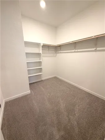 a view of an empty walk in closet