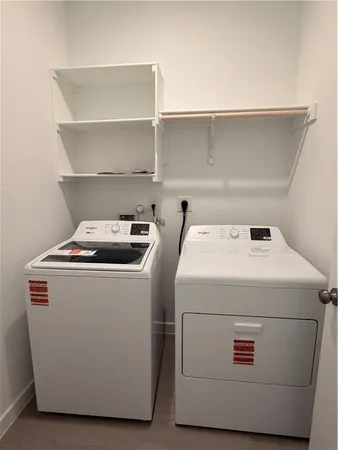 a utility room with washer and dryer