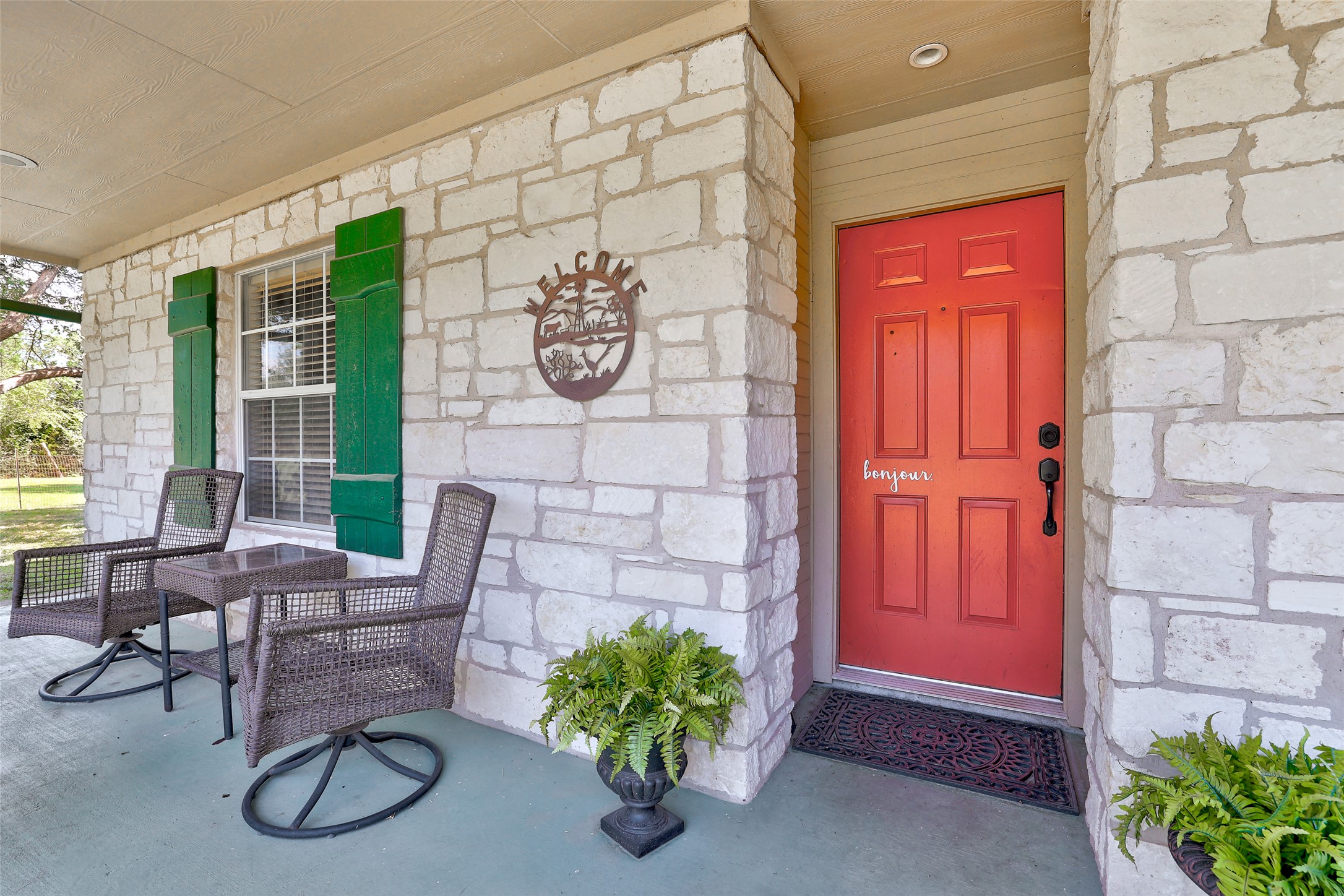 125 Kyle Lane Georgetown, TX 78633 - Photo 9 of 34 Doorway to property featuring stone siding and covered porch